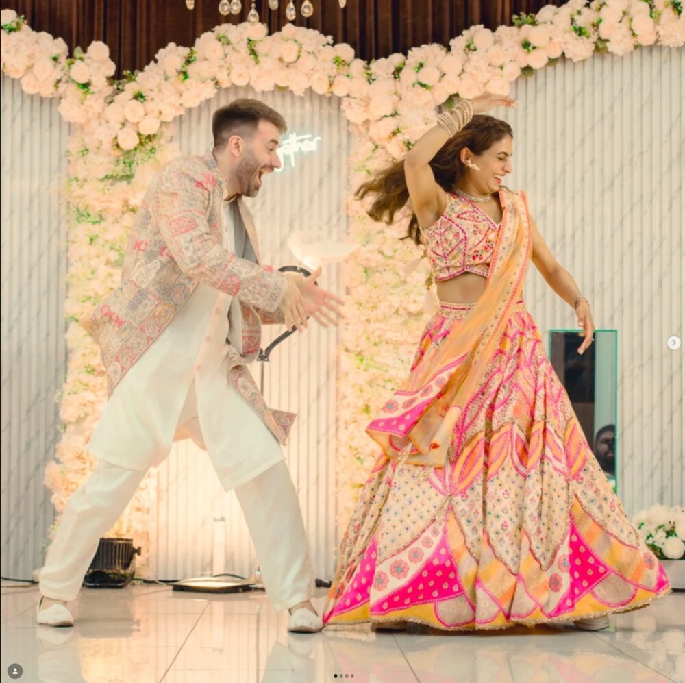 Jon and his partner dancing at their sangeet